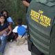 U.S. Border Patrol agents, part of Customs and Border Protection, as they detain Central American asylum seekers near McAllen, Texas in June 2018.